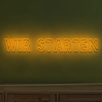 neon-schriftzug-wir-starten-orange 1